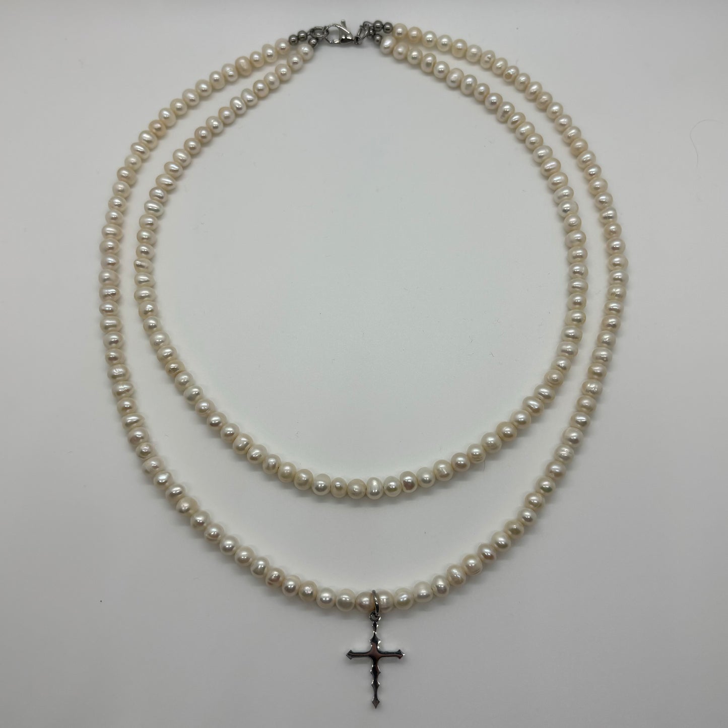 DOUBLE PEARL CROSS NECKLACE